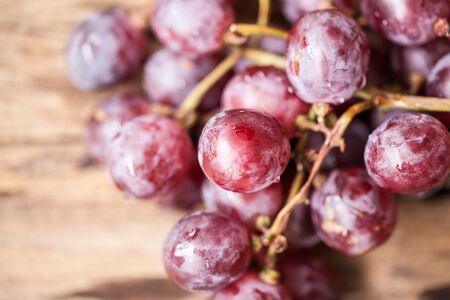 red grape on wooden backgroundの写真素材