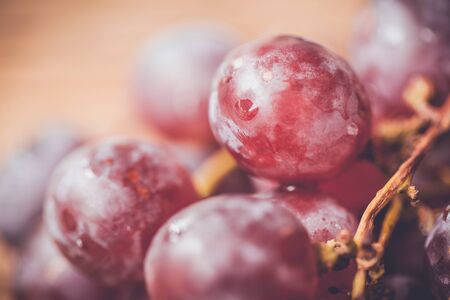 red grape on wooden background