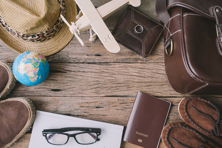 Travel accessories on wooden tableの写真素材