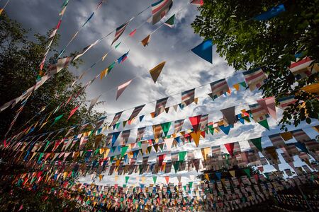 Colorful flags with blue skyの写真素材