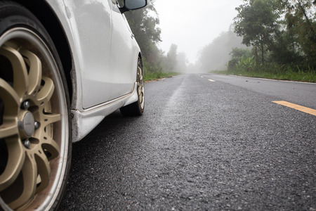 car on the forest roadの写真素材