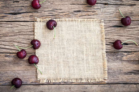 red cherry on wooden backgroundの写真素材
