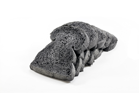 charcoal bread on white backgroundの写真素材