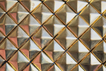 Rusty golden diamonts pattern. Plastic background
