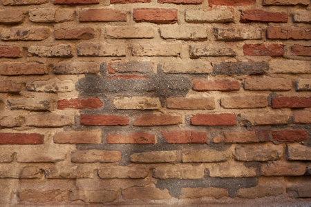 Close up of old brick wall with reflection of the son at dawn for background or texture