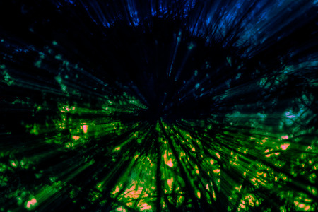 Creative abstract artistic background reminding of a burst full of dynamics and colourの写真素材
