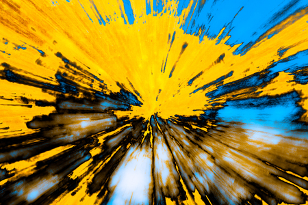 Creative abstract artistic background reminding of a burst full of dynamics and colourの写真素材