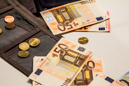 A composition of euro banknotes and coins providing great options to be used for illustrating subjects as business, banking, media, presentations etc., as well as for money related blogs or article featuresの写真素材