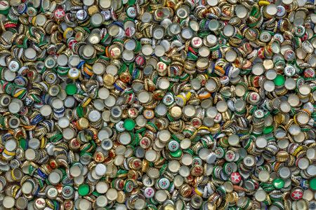 Berlin, Germany, 12.05.2018, enormous quantity of metal beer caps in golden, red, green, blue, white, silver etc. Recycling, environment, ecologyのeditorial素材