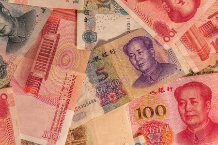 A composition of Chinese Renminbi RMB. People's Currency. Yuan CNY banknotes providing great options to be used for illustrating subjects as business, banking, media, etc.の写真素材