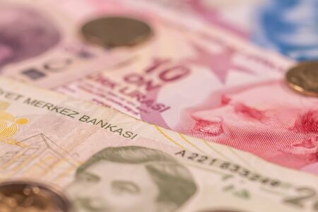 A composition of Turkish lira TL. TRY banknotes and coins providing great options to be used for illustrating subjects as business, banking, media, presentations etc.の写真素材