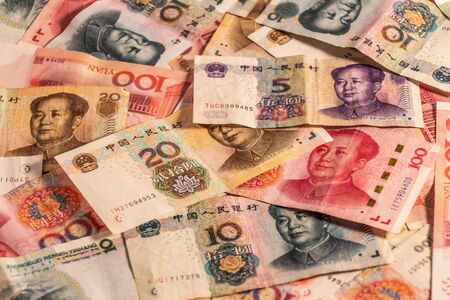 A composition of Chinese Renminbi RMB. People's Currency. Yuan CNY banknotes providing great options to be used for illustrating subjects as business, banking, media, etc.の写真素材