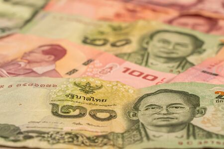 A composition of Thai baht. THB banknotes providing great options to be used for illustrating...