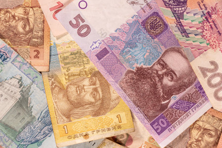 A composition of Ukrainian hryvnia. UAH banknotes providing great options to be used for illustrating subjects as business, banking, media, etc.の写真素材