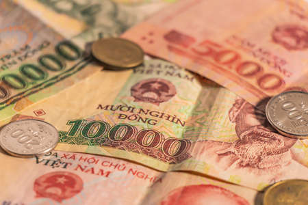 A composition of Vietnamese dong VND banknotes and coins providing great options to be used for...