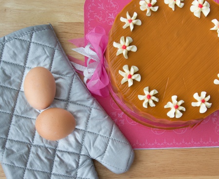 The eggs and tea cake on wood bench