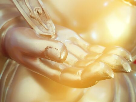 Golden hand of buddha statue close upの写真素材