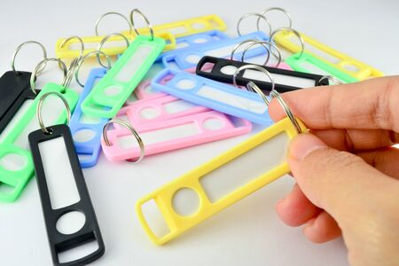 Hand holding key chain with space for text