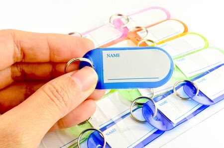 Hand holding key chain with space for text