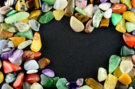 Closeup colorful stones on black backgroundの写真素材