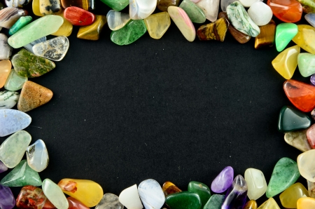 Closeup colorful stones on black backgroundの写真素材