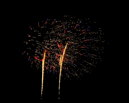 Brightly colorful fireworks in the night skyの写真素材