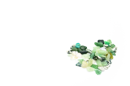 Green stones in heart shape isolatedの写真素材