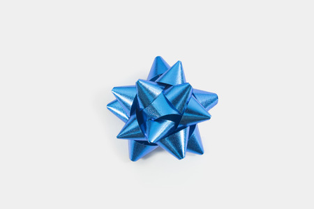 Blue gift bow isolated on white backgroundの写真素材