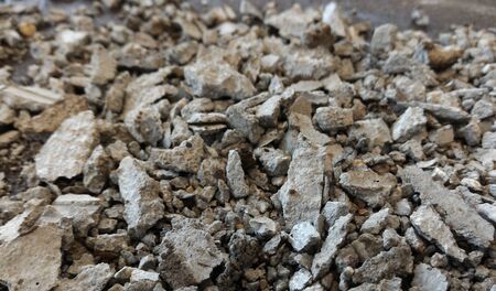 scrap stone and scap cement on dirty groundの写真素材