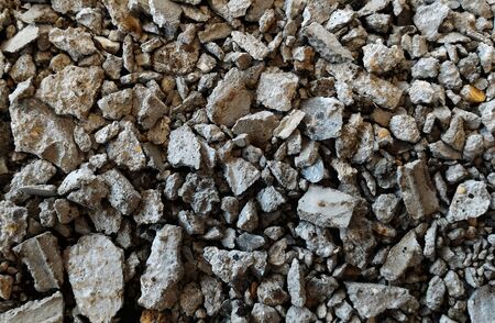 scrap stone and scap cement on dirty groundの写真素材