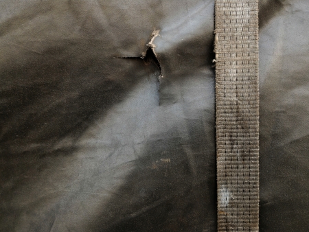 detail dirty old straps truck and dirty old canvas covered truck on truck for transportationの写真素材
