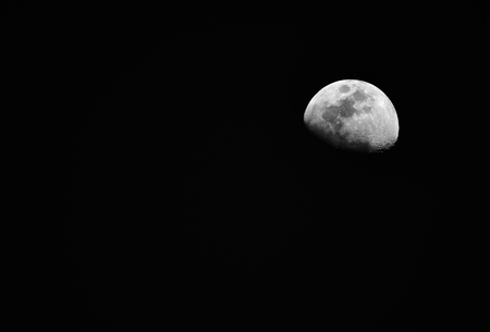 Detail half moon in darkness for backgroundの写真素材