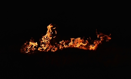 Detail flame of fire in darkness for backgroundの写真素材