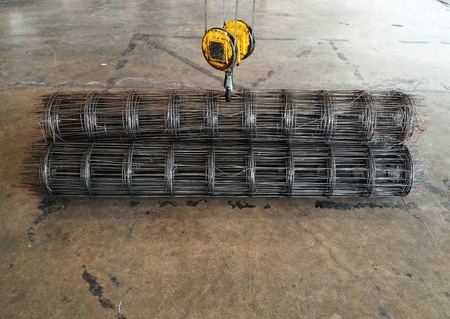 big yellow hook of crane lift up wire meshの写真素材