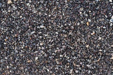 many little stone from asphalt road on wet groundの写真素材