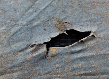 dirty old canvas covered truck on truck for transportation backgroundの写真素材