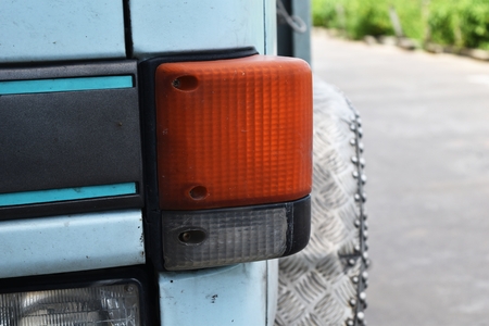 old orange headlight used for a long timeの写真素材