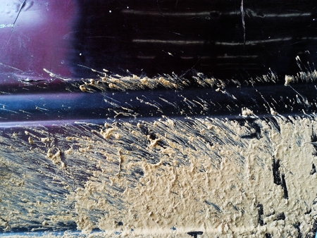 dry soil mud on old car after in rainy seasonの写真素材