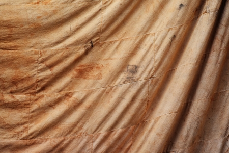 smudge on old brown cloth for backgroundの写真素材