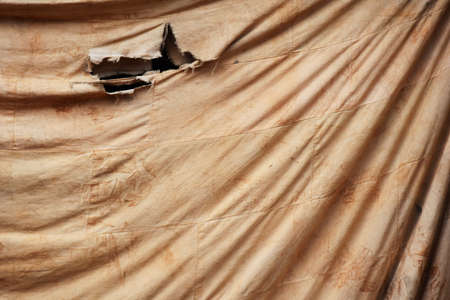 smudge on old brown cloth for backgroundの写真素材