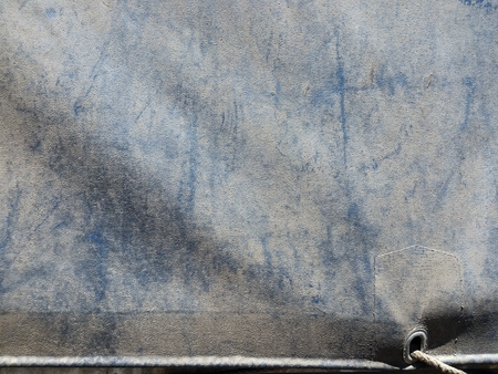 dirty old canvas covered truck on truck for transportation backgroundの写真素材