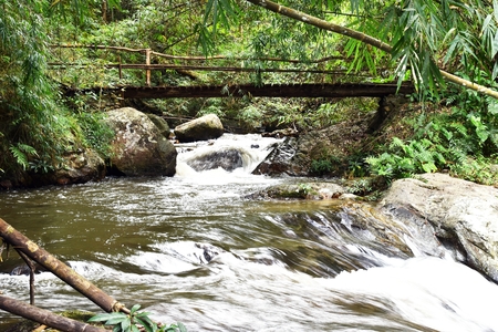 wood bridge over Chae Son waterfall in Chae Son National Park in Lampang Province, Thailandの写真素材