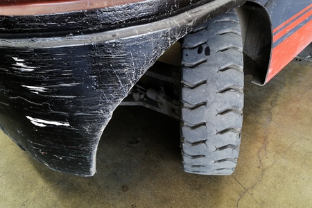 old wheel of forklift truck after used a long timeの写真素材