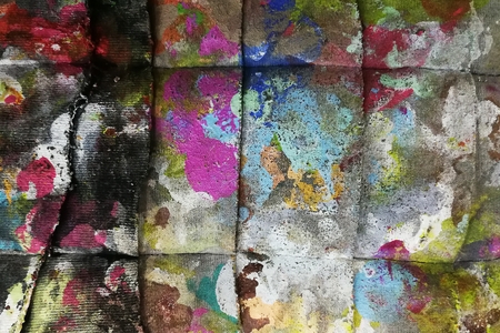 colorful paint on dirty fabric