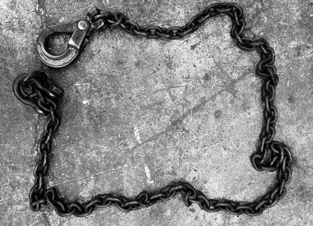 old chain on concrete in black and white photography