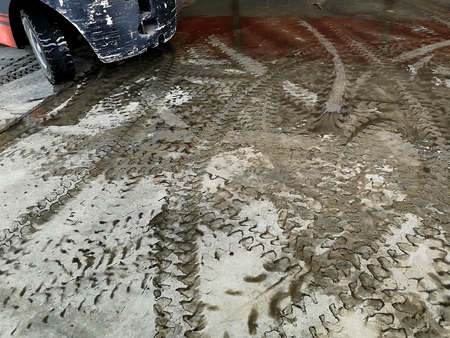 tire track of forklift on dirty groundの写真素材