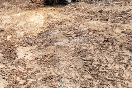 lots tire track on soil for backgroundの写真素材