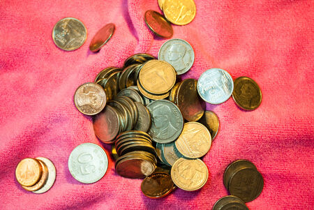 Coins of Thailand put on a pink background.の写真素材