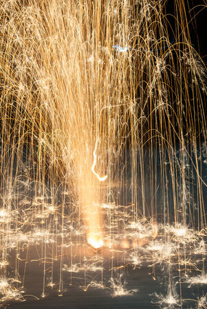 fireworks lighting the night sky in different colorsの写真素材