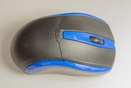 Hand using a  mouse on white background